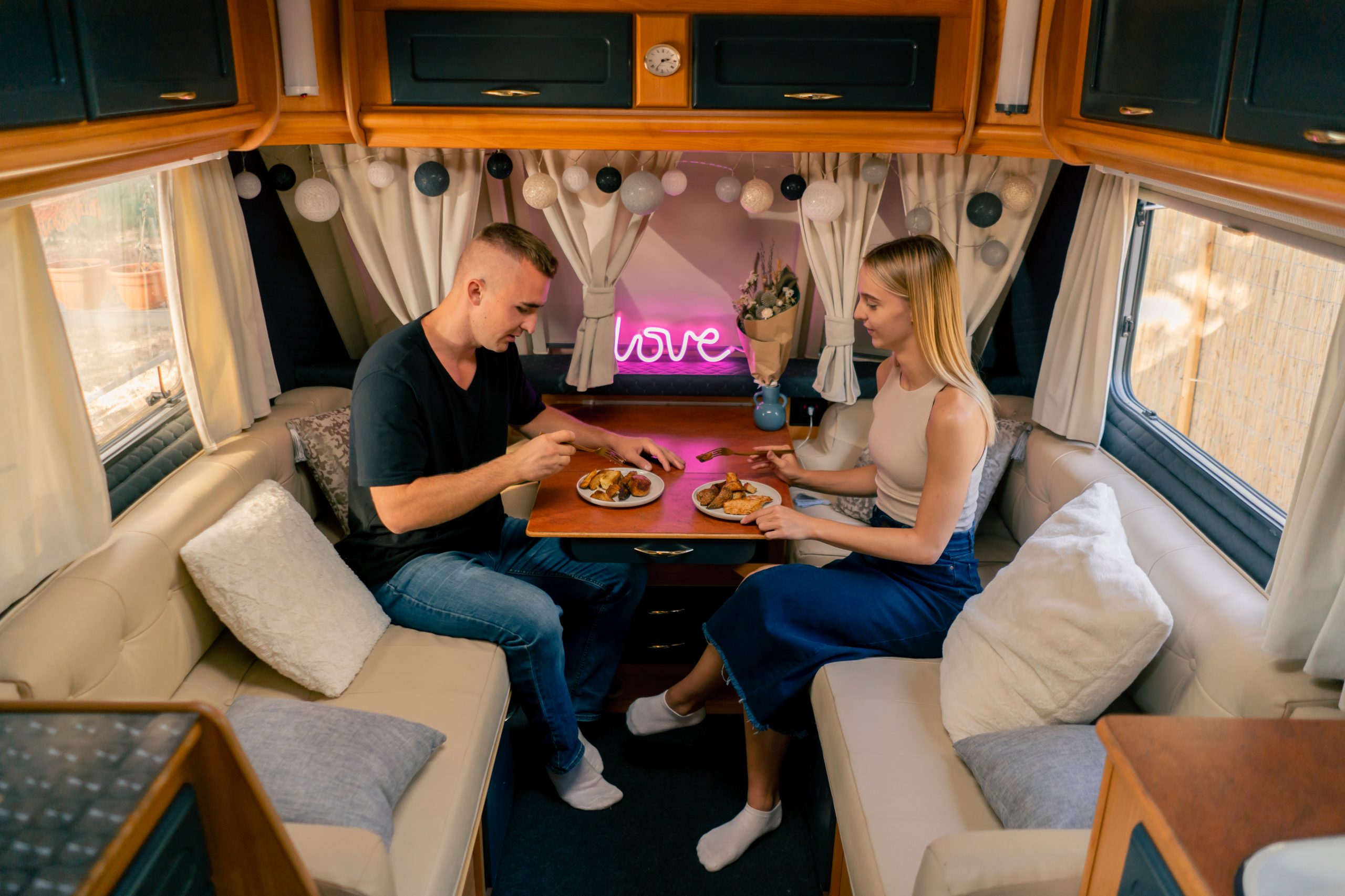 Affectionate couple shares a snack inside cozy cam