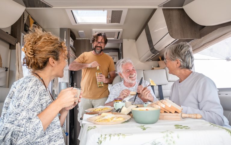 Friends enjoying food and drink together indoors
