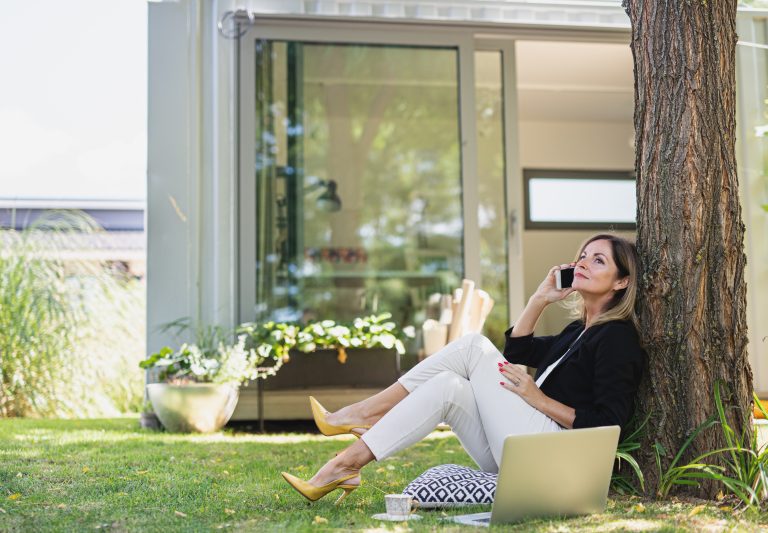 Mature woman working in home office outdoors in ga