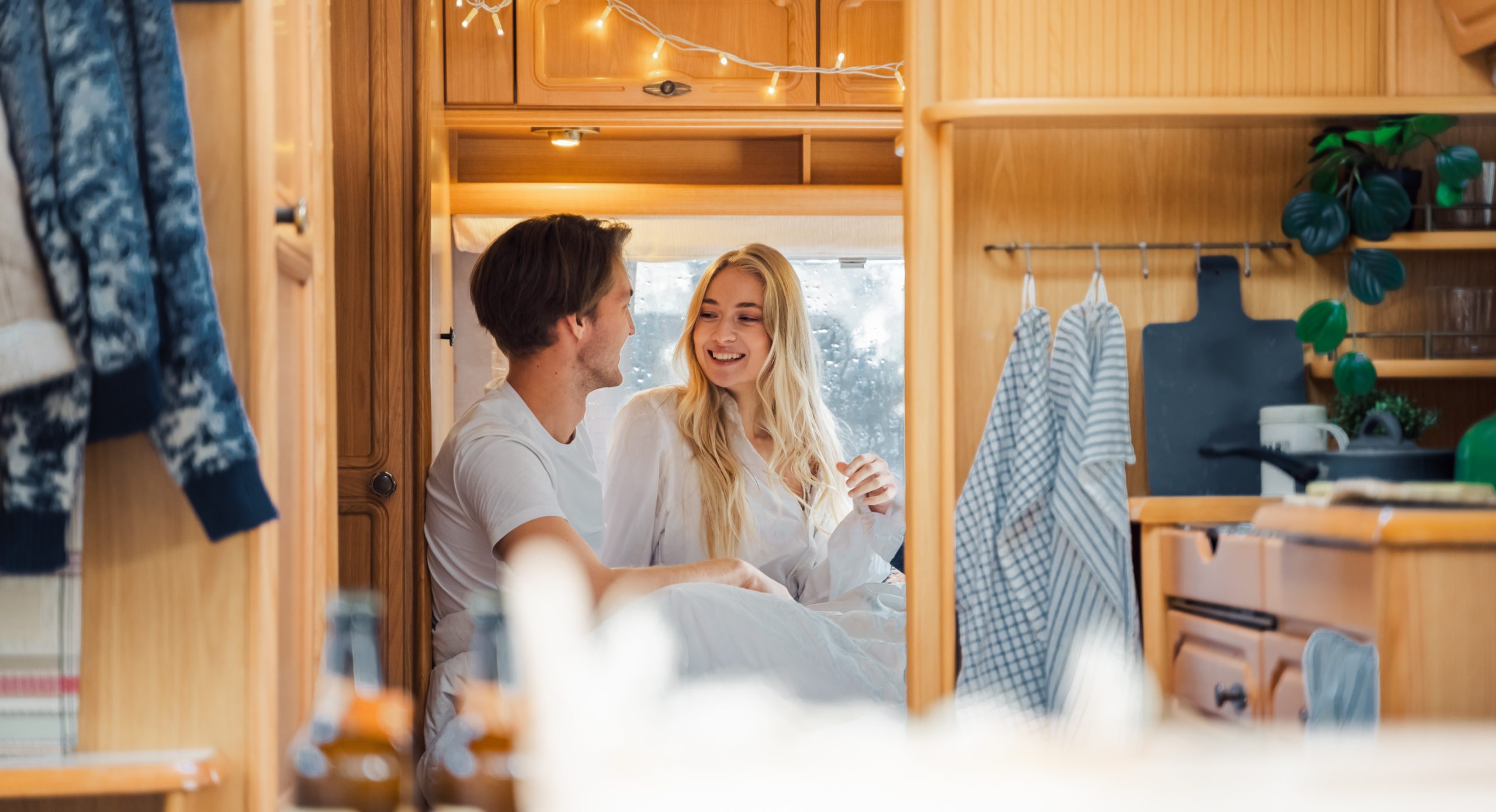 Young just married couple traveling in camper hous